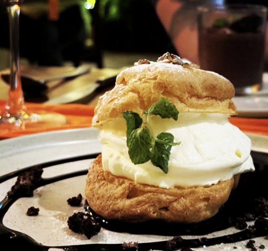 Choux Royale dessert with Chantilly cream and chocolate sauce — Maison Lucien Hội An