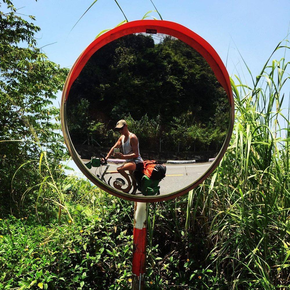Chef John Gallais on bicycle at Sơn Trà peninsula, Đà Nẵng Vietnam 2021